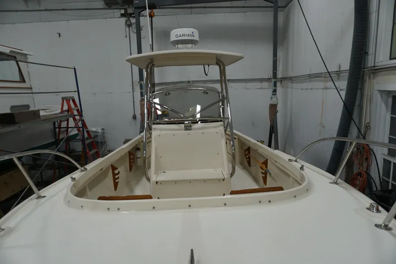 Slide: The Image of 2003 Padebco 23 boat interior with Garmin equipment in a workshop setting. - 34