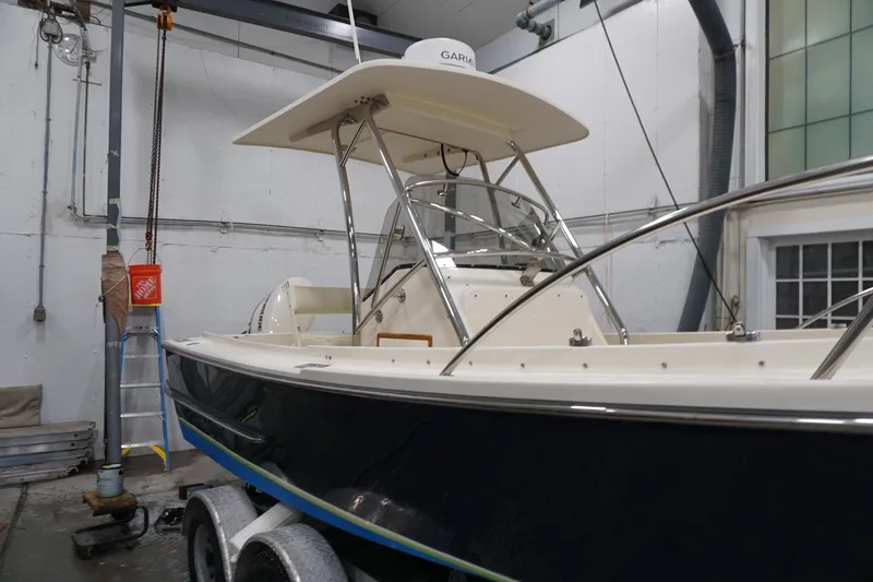 Slide: The Image of 2003 Padebco 23 boat in a workshop, featuring a sleek design and sturdy construction. - 38