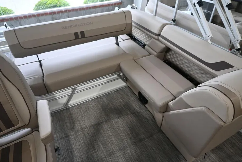 Slide: The Image of 2026 Bennington S Swingback 22 SSB boat interior with beige seating and modern design. - 10