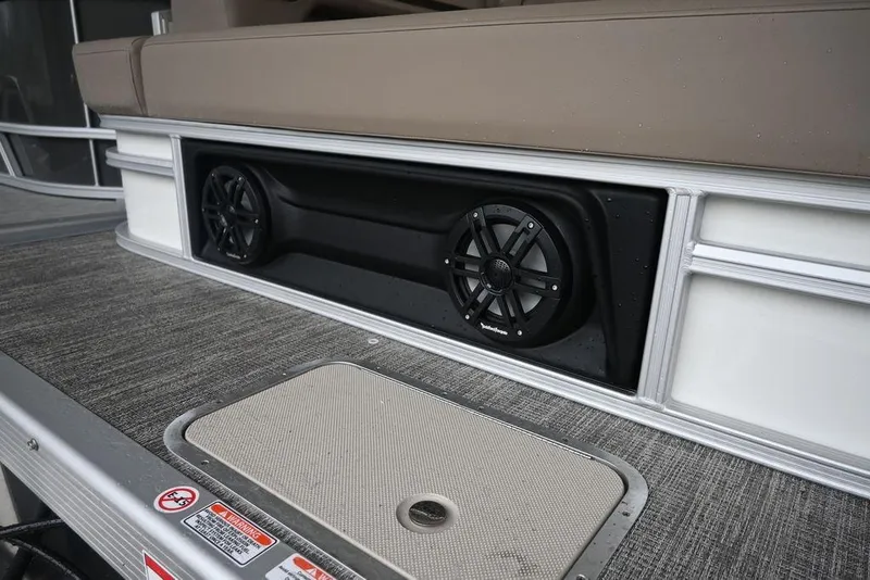 Slide: The Image of 2026 Bennington S Swingback 22 SSB boat with integrated speakers and textured flooring. - 16
