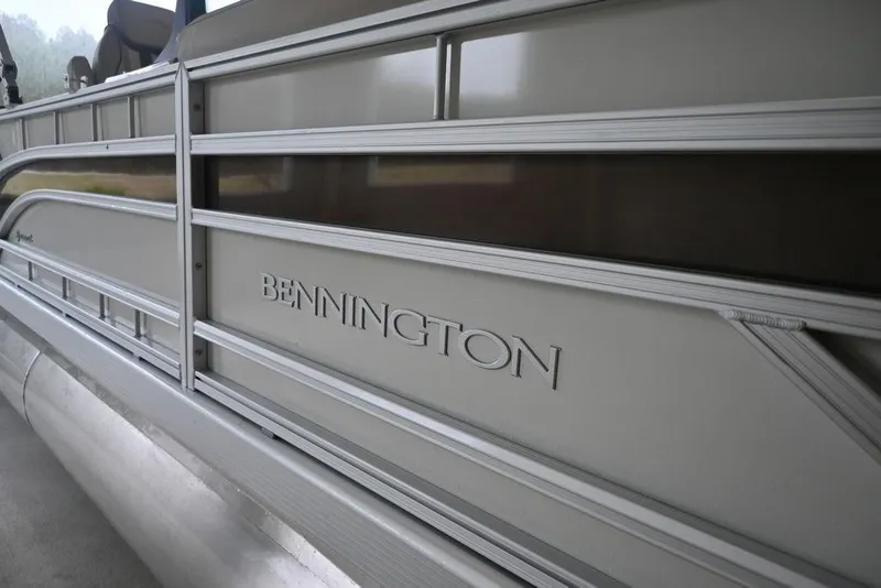 Slide: The Image of 2026 Bennington S Swingback 22 SSB pontoon boat side view with logo. - 3
