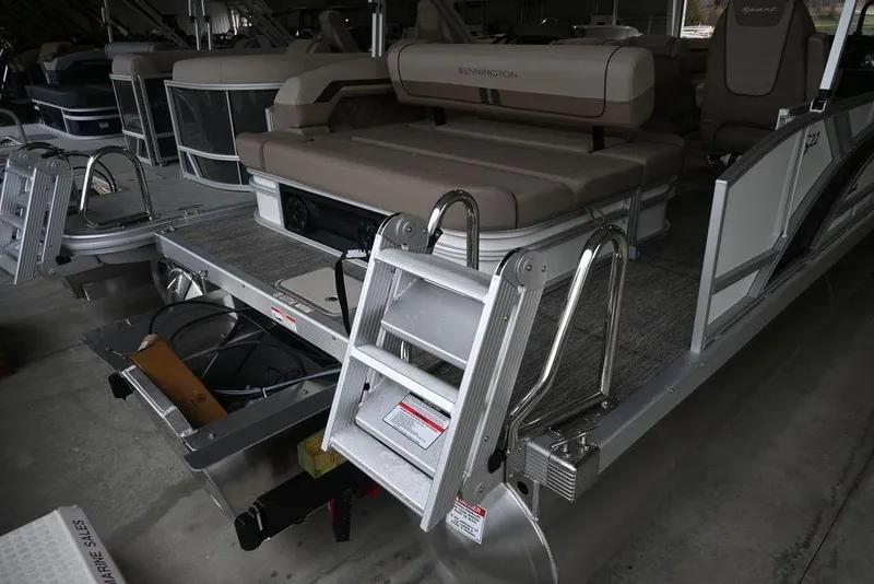 Slide: The Image of 2026 Bennington S Swingback 22 SSB pontoon boat with rear seating and ladder. - 5