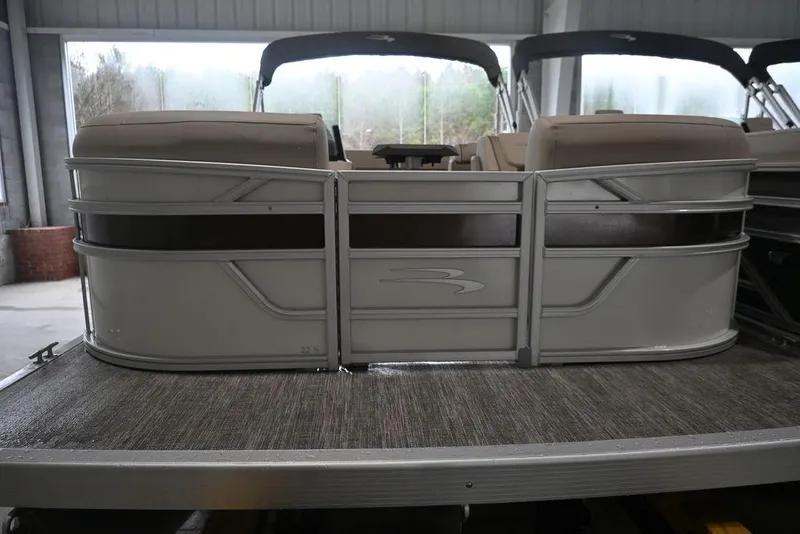 Slide: The Image of 2026 Bennington S Swingback 22 SSB pontoon boat in a showroom setting. - 7