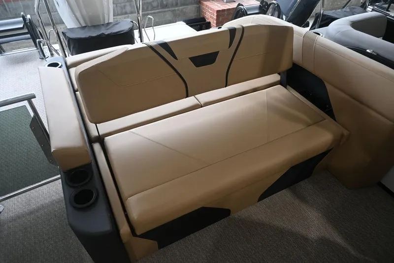 Slide: The Image of Evotti 723CS 2026 boat seating with beige upholstery and integrated cup holders. - 15