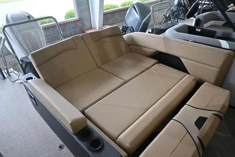 Slide: The Image of Luxurious seating area in 2026 Evotti 723CS boat with beige upholstery and cup holders. - 17