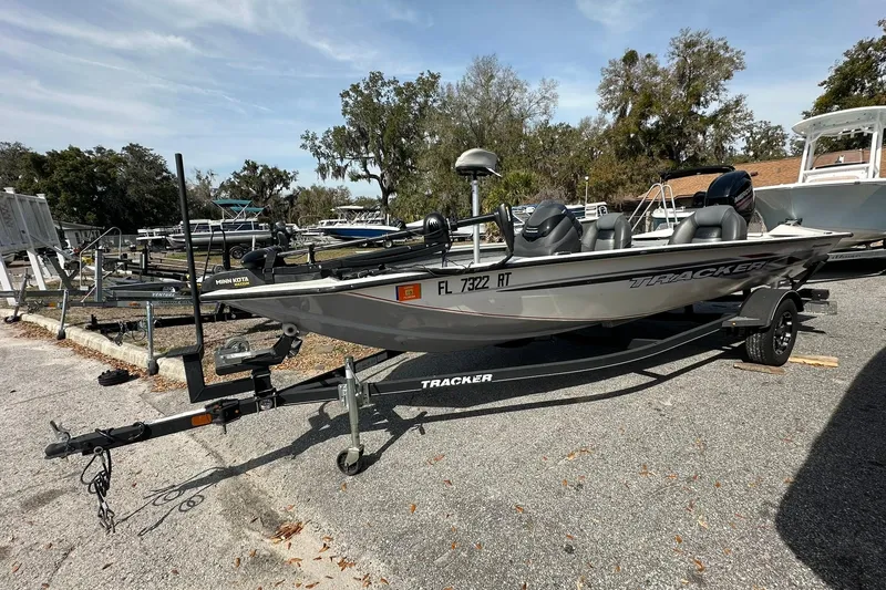 The Image of 2019 Tracker Pro Team 175 TXW boat on trailer in outdoor setting. - 0
