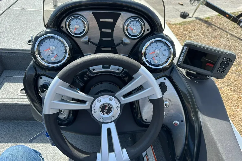 Slide: The Image of 2019 Tracker Pro Team 175 TXW boat dashboard with steering wheel and gauges. - 10