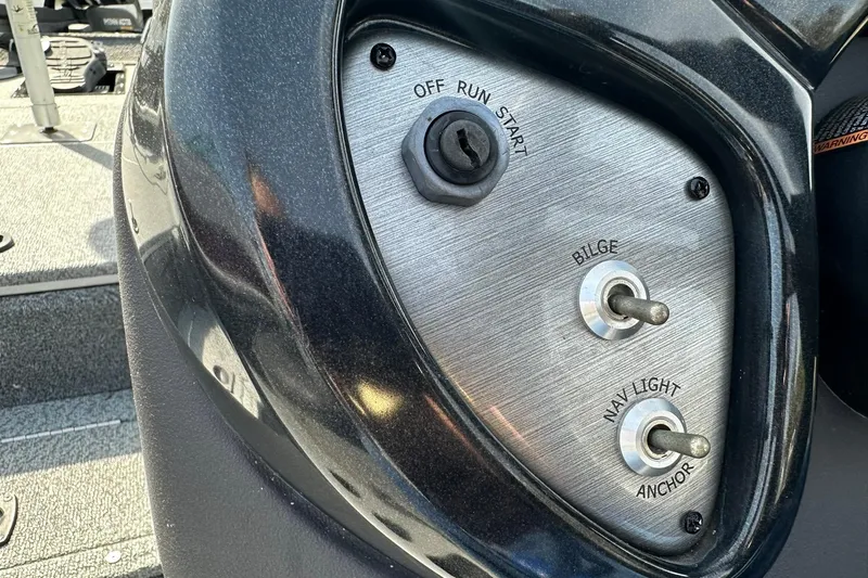 Slide: The Image of 2019 Tracker Pro Team 175 TXW boat control panel with switches and ignition. - 11