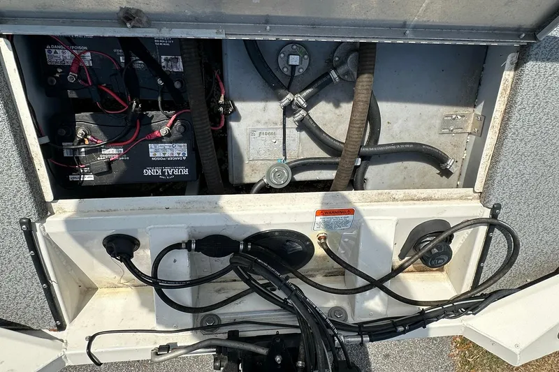 Slide: The Image of 2019 Tracker Pro Team 175 TXW boat battery compartment with wiring and connections. - 16