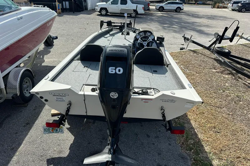 Slide: The Image of 2019 Tracker Pro Team 175 TXW boat with Mercury 60 engine, parked outdoors. - 18