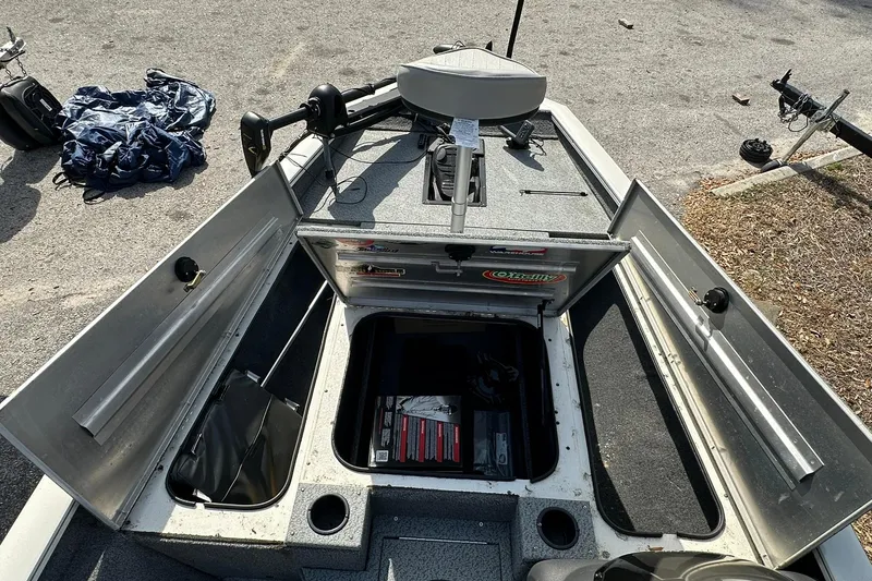Slide: The Image of 2019 Tracker Pro Team 175 TXW boat interior with open storage compartments. - 6