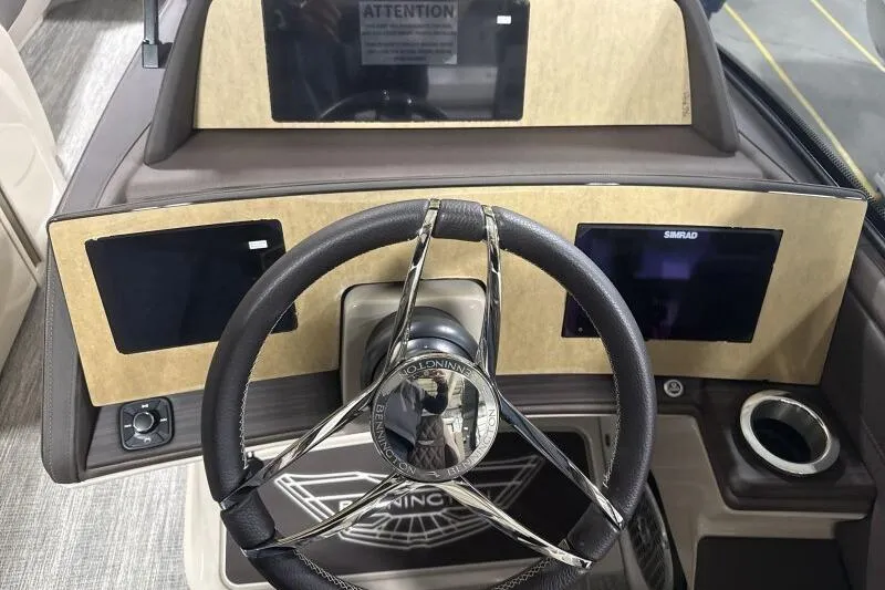Slide: The Image of Steering console of 2026 Bennington 25 QXSBWASF boat with modern controls and displays. - 16