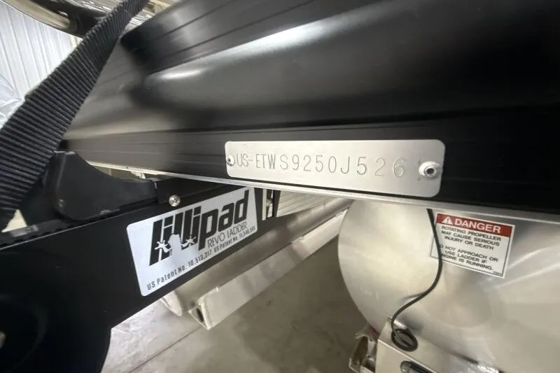 Slide: The Image of 2026 Bennington 25 QXSBWASF boat with visible serial number and safety warning labels. - 9