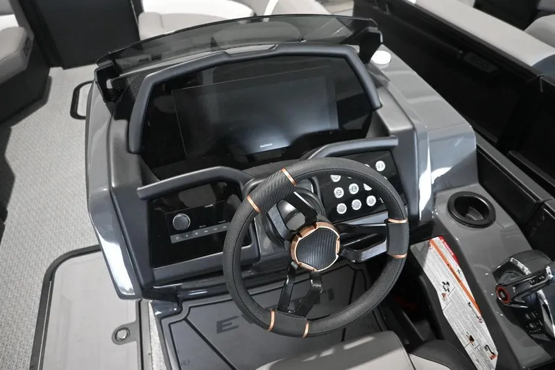 Slide: The Image of Cockpit of 2026 Evotti 723QL boat with modern steering and control panel. - 13