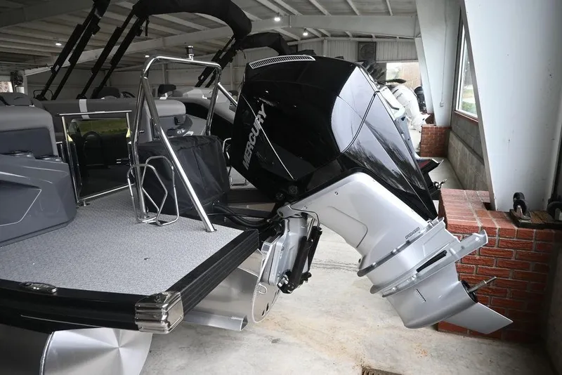 Slide: The Image of 2026 Evotti 723QL boat with Mercury outboard motor in a showroom. - 3