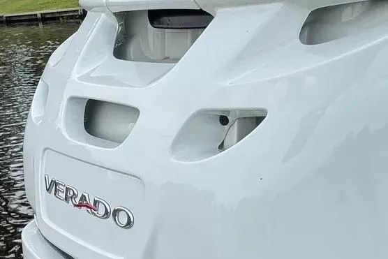 Slide: The Image of 2022 Boston Boatworks Vantage 240 with Verado engine, docked by the water. - 11