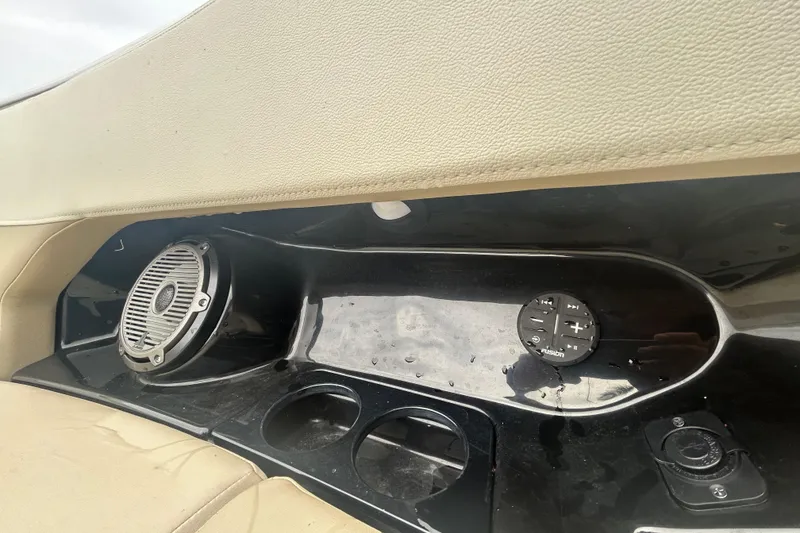 Slide: The Image of Interior of a 2022 Boston Whaler 240 Vantage boat with speaker and controls. - 19