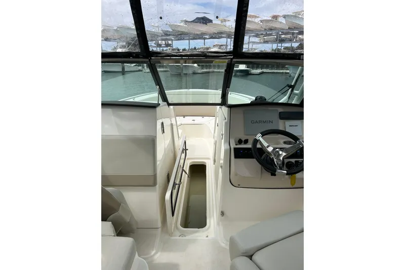 Slide: The Image of 2022 Boston Whaler 240 Vantage boat interior with Garmin navigation system. - 21