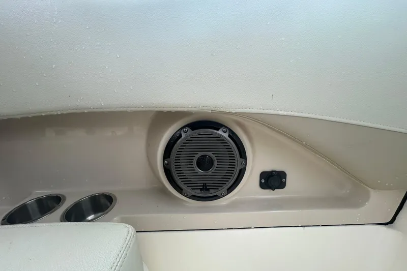 Slide: The Image of Speaker and cup holders on 2022 Boston Whaler 240 Vantage boat interior. - 22