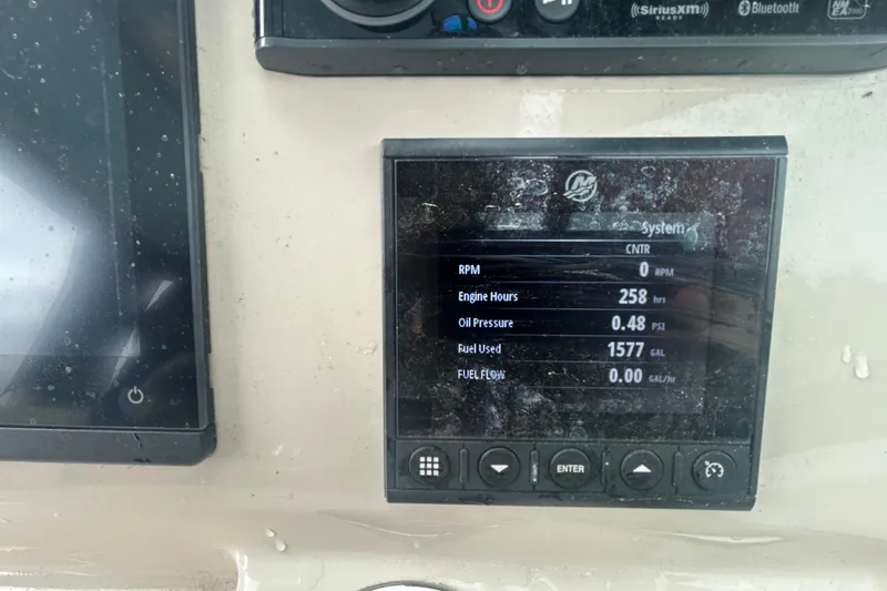 Slide: The Image of Dashboard display of a 2022 Boston Whaler 240 Vantage showing engine metrics. - 29
