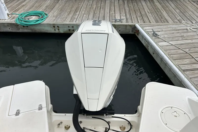 Slide: The Image of Boston Whaler 240 Vantage 2022 boat with Mercury outboard engine at dock. - 38