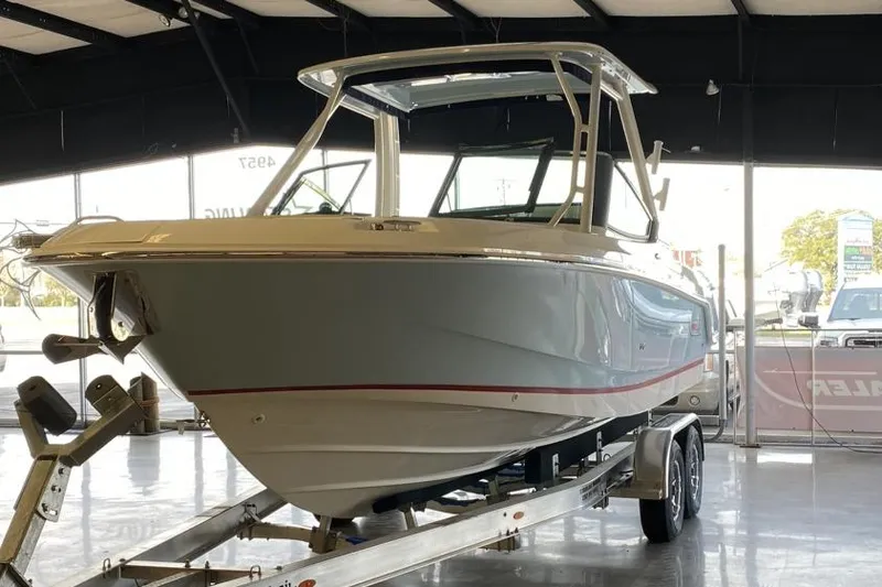 Slide: The Image of 2022 Boston Boatworks Vantage 240 on trailer in showroom. - 4