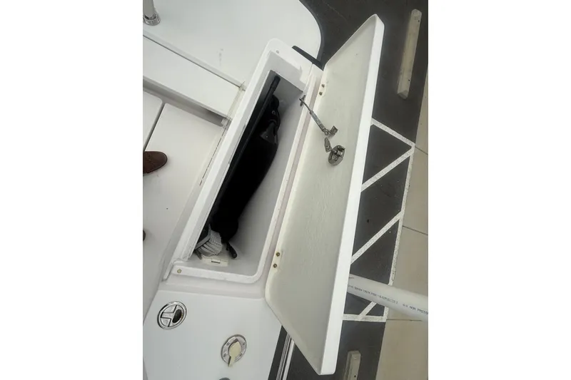 Slide: The Image of Open storage compartment on 2021 Axopar 28 T-Top boat deck. - 11