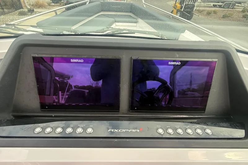 Slide: The Image of Dashboard of 2021 Axopar 28 T-Top with dual Simrad displays. - 5