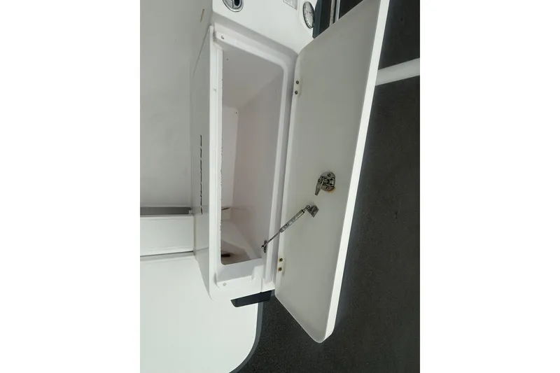 Slide: The Image of Open storage compartment on a 2021 Axopar 28 T-Top boat. - 8