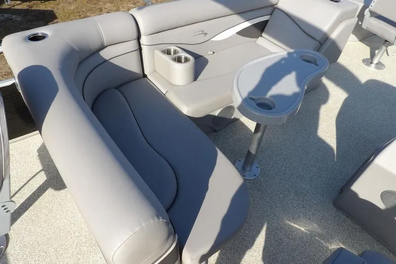 Slide: The Image of Luxurious seating area on 2020 Bennington 20 SFV pontoon boat with cup holders. - 19