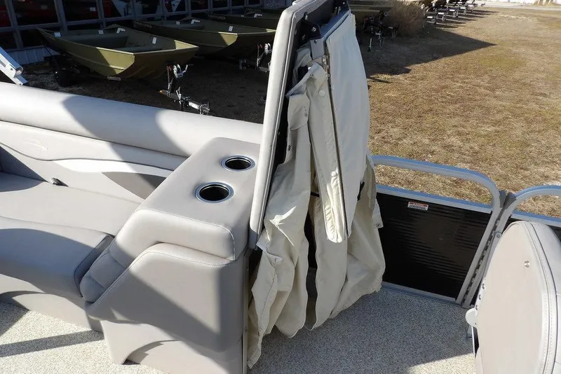 Slide: The Image of 2020 Bennington 20 SFV boat interior with beige seating and cup holders. - 20