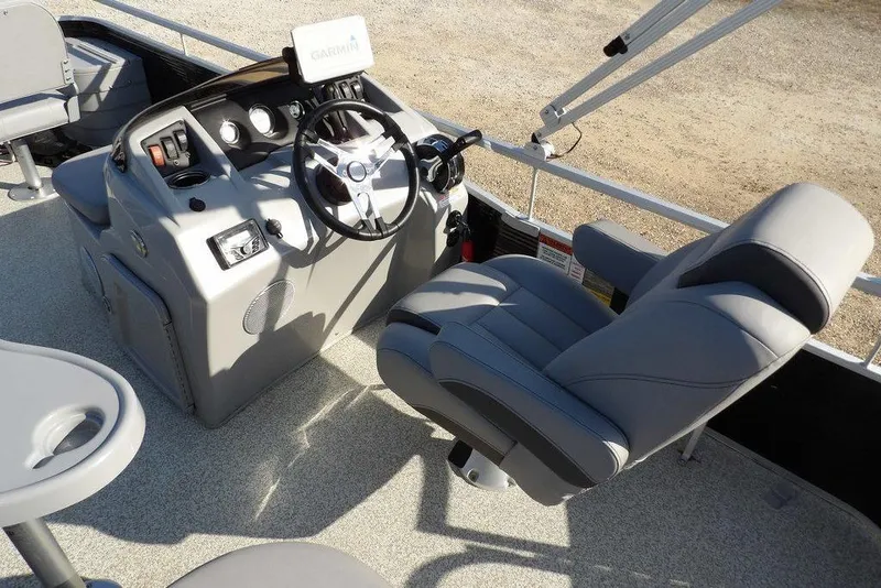 Slide: The Image of 2020 Bennington 20 SFV boat interior with steering console and comfortable seating. - 22