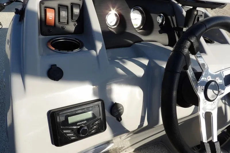 Slide: The Image of 2020 Bennington 20 SFV boat dashboard with steering wheel and control panel. - 23