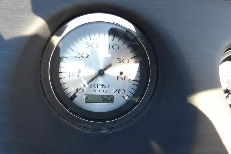 Slide: The Image of Close-up of a Bennington 20 SFV 2020 RPM gauge displaying 523 hours. - 28