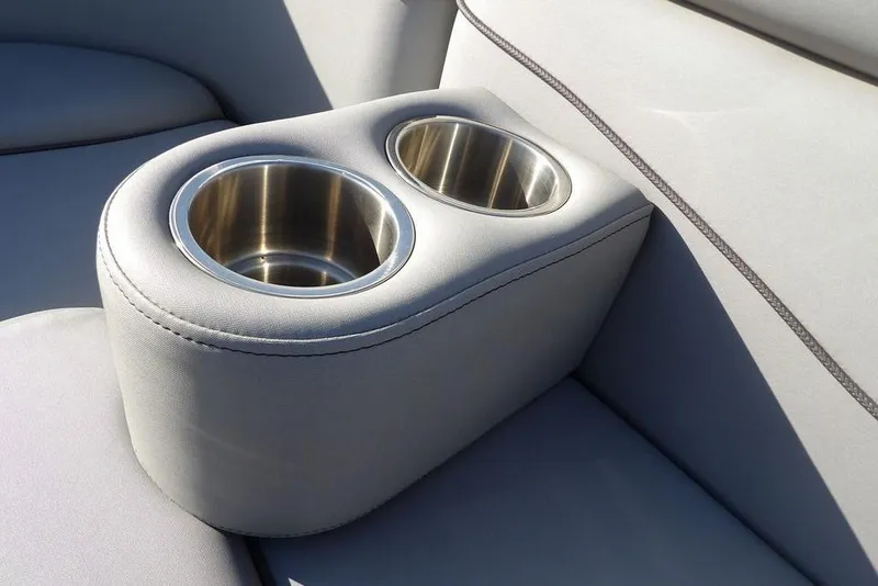 Slide: The Image of Cup holders on a 2020 Bennington 20 SFV boat seat, featuring sleek stainless steel design. - 29