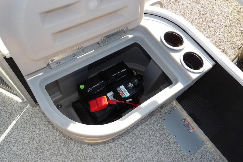 Slide: The Image of Open storage compartment with battery in 2020 Bennington 20 SFV boat. - 31