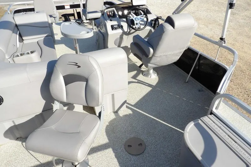 Slide: The Image of 2020 Bennington 20 SFV boat interior with gray seating and steering console. - 33