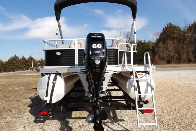 Slide: The Image of 2020 Bennington 20 SFV pontoon boat with Mercury 60 HP engine, parked on gravel. - 7