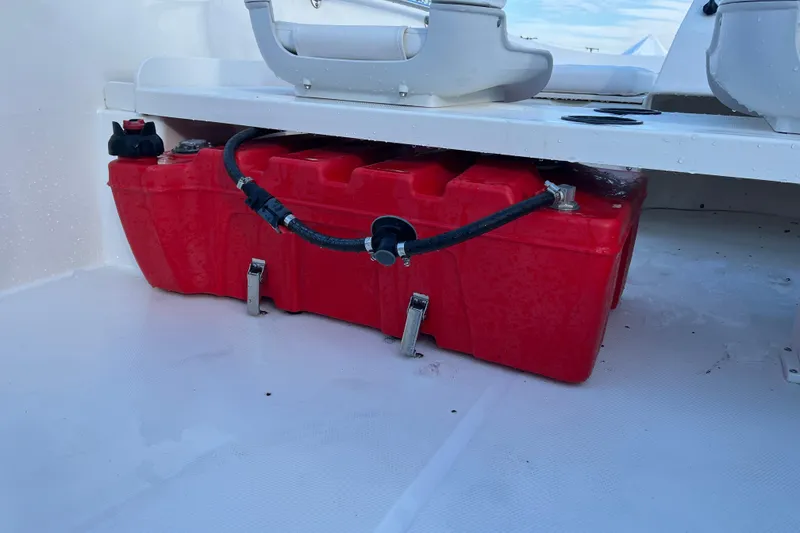 Slide: The Image of Red fuel tank on a 2018 Boston Whaler 170 Super Sport boat deck. - 12
