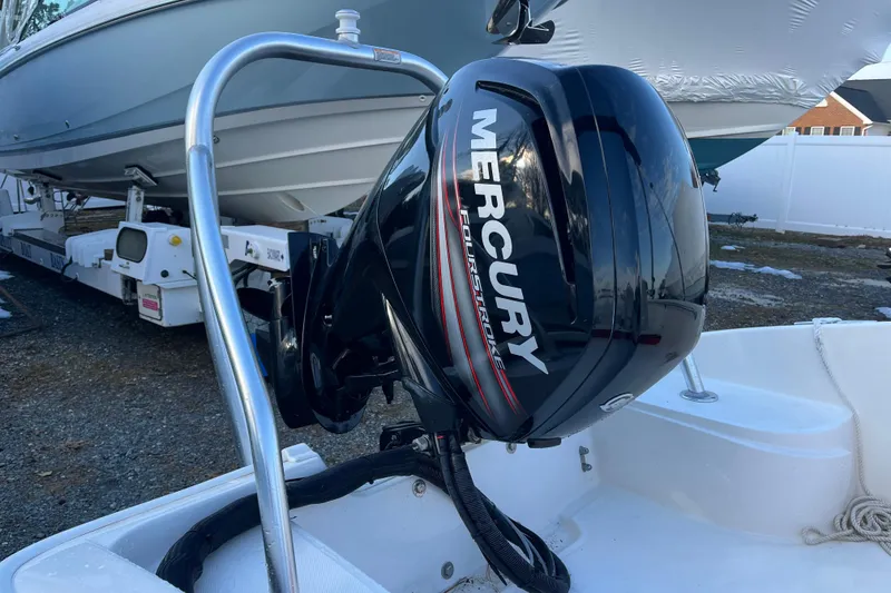 Slide: The Image of 2018 Boston Whaler 170 Super Sport with Mercury FourStroke engine, docked outdoors. - 18