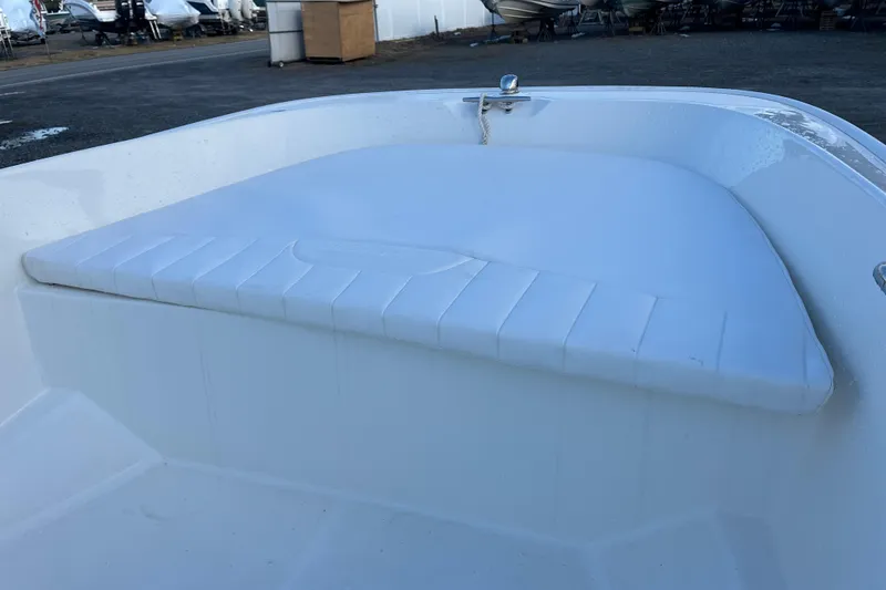 Slide: The Image of 2018 Boston Whaler 170 Super Sport boat interior with cushioned seating. - 9