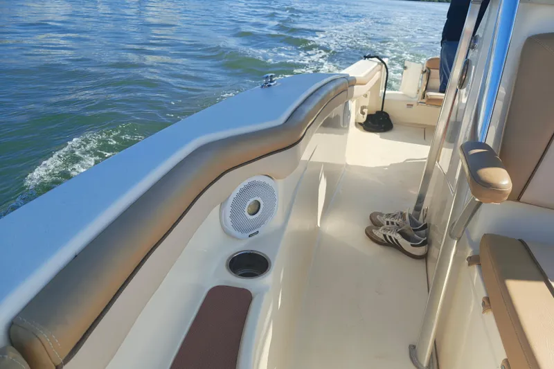 Slide: The Image of 2020 Scout 215 XSF boat interior with speaker and shoes on deck. - 4