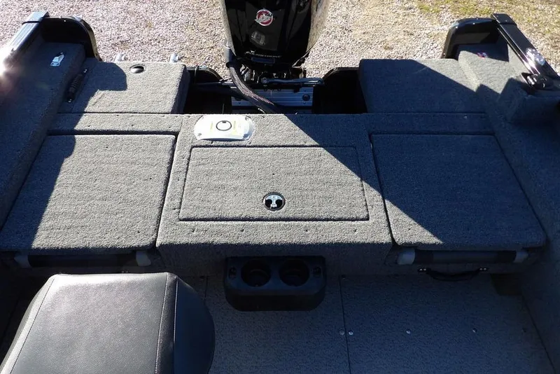 Slide: The Image of 2025 Lund 1775 Adventure SS boat interior with carpeted storage compartments. - 18