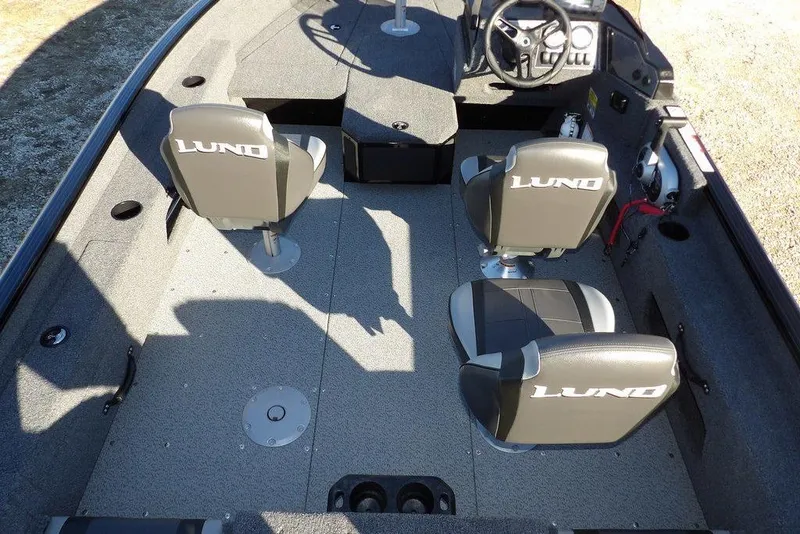 Slide: The Image of 2025 Lund 1775 Adventure SS boat interior with seating and steering console. - 19