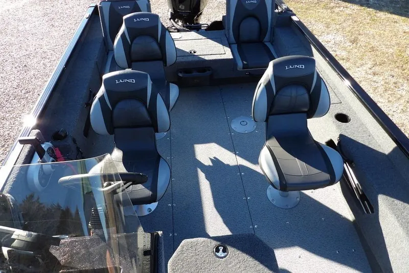 Slide: The Image of 2025 Lund 1775 Adventure SS boat interior with four seats and steering console. - 21