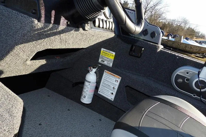 Slide: The Image of Interior of 2025 Lund 1775 Adventure SS boat with fire extinguisher and control panel. - 30