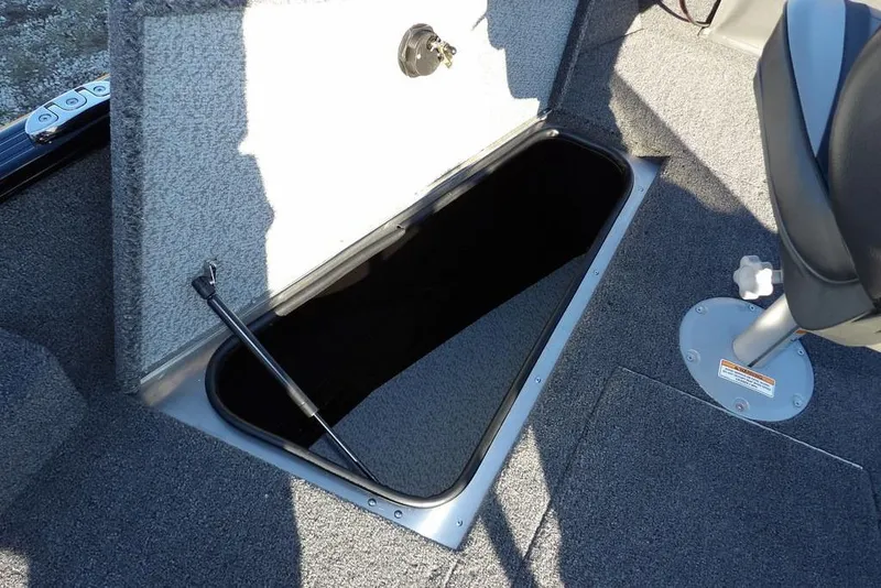 Slide: The Image of Open storage compartment in 2025 Lund 1775 Adventure SS boat interior. - 34