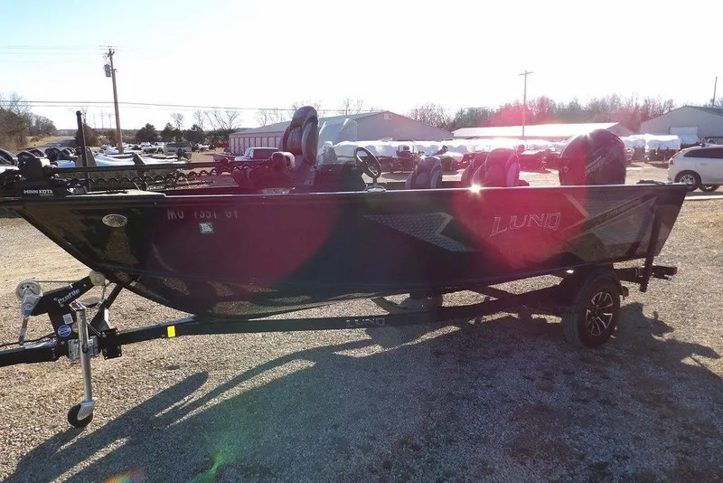 Slide: The Image of 2025 Lund 1775 Adventure SS boat on trailer in sunny outdoor setting. - 4