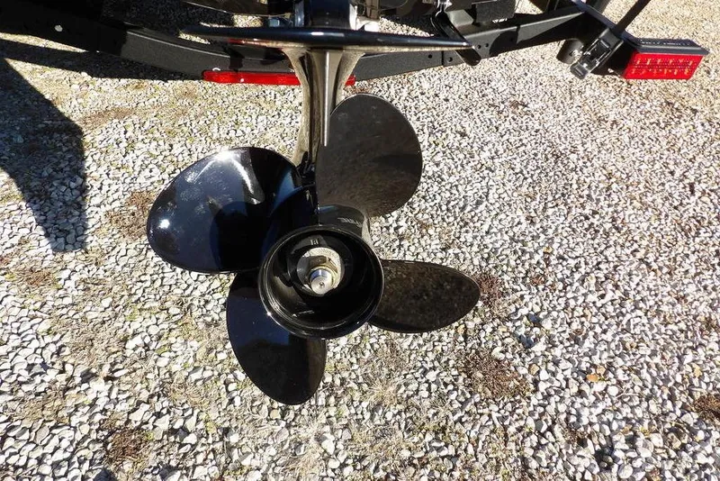 Slide: The Image of Propeller of 2025 Lund 1775 Adventure SS boat on gravel surface. - 41