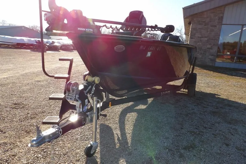 Slide: The Image of 2025 Lund 1775 Adventure SS boat on trailer, parked outdoors in sunlight. - 44